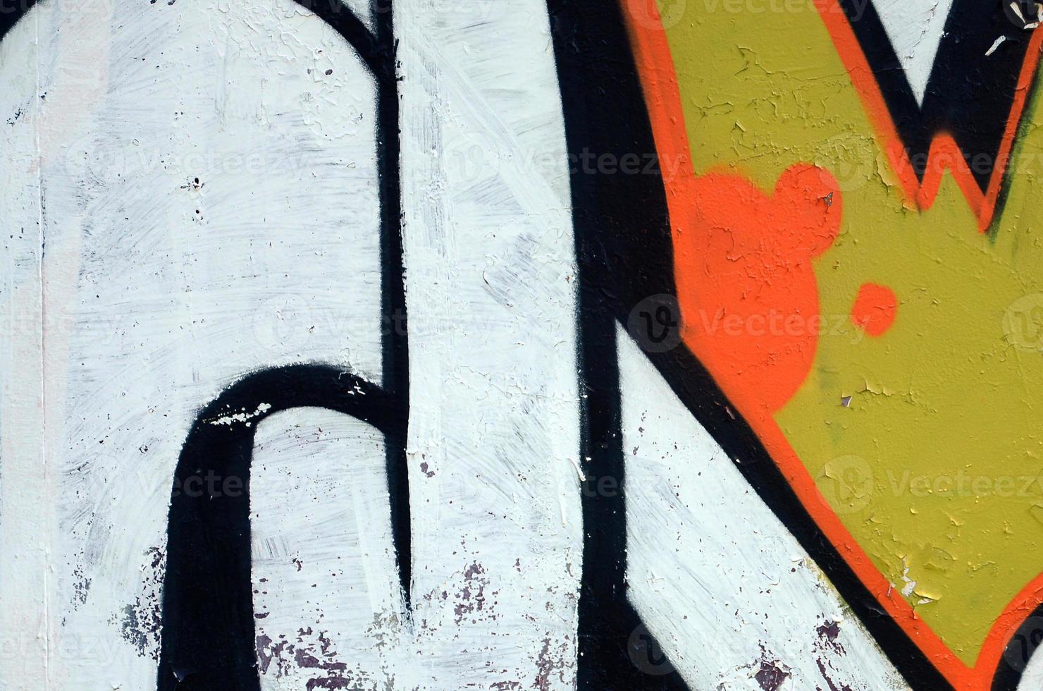 Street art. Abstract background image of a fragment of a colored graffiti painting in white and orange tones photo