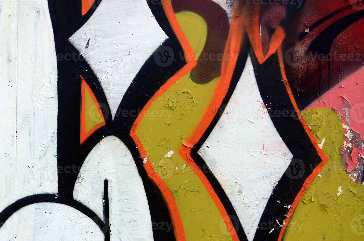 Street art. Abstract background image of a fragment of a colored graffiti painting in white and orange tones photo