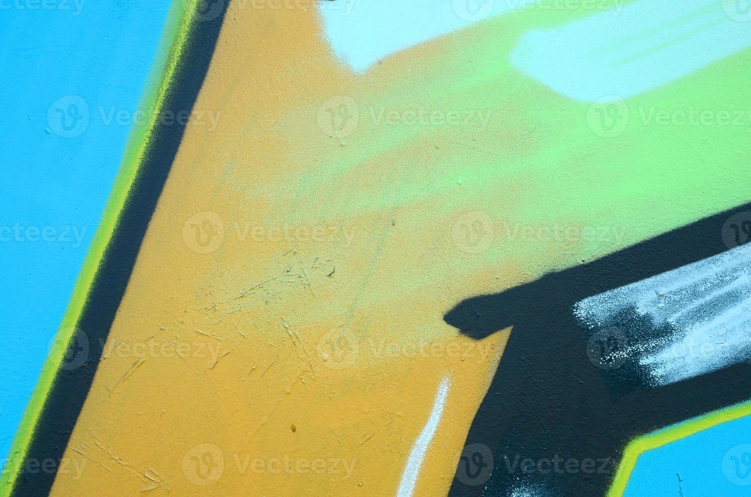 Street art. Abstract background image of a fragment of a colored graffiti painting in khaki green and orange tones photo