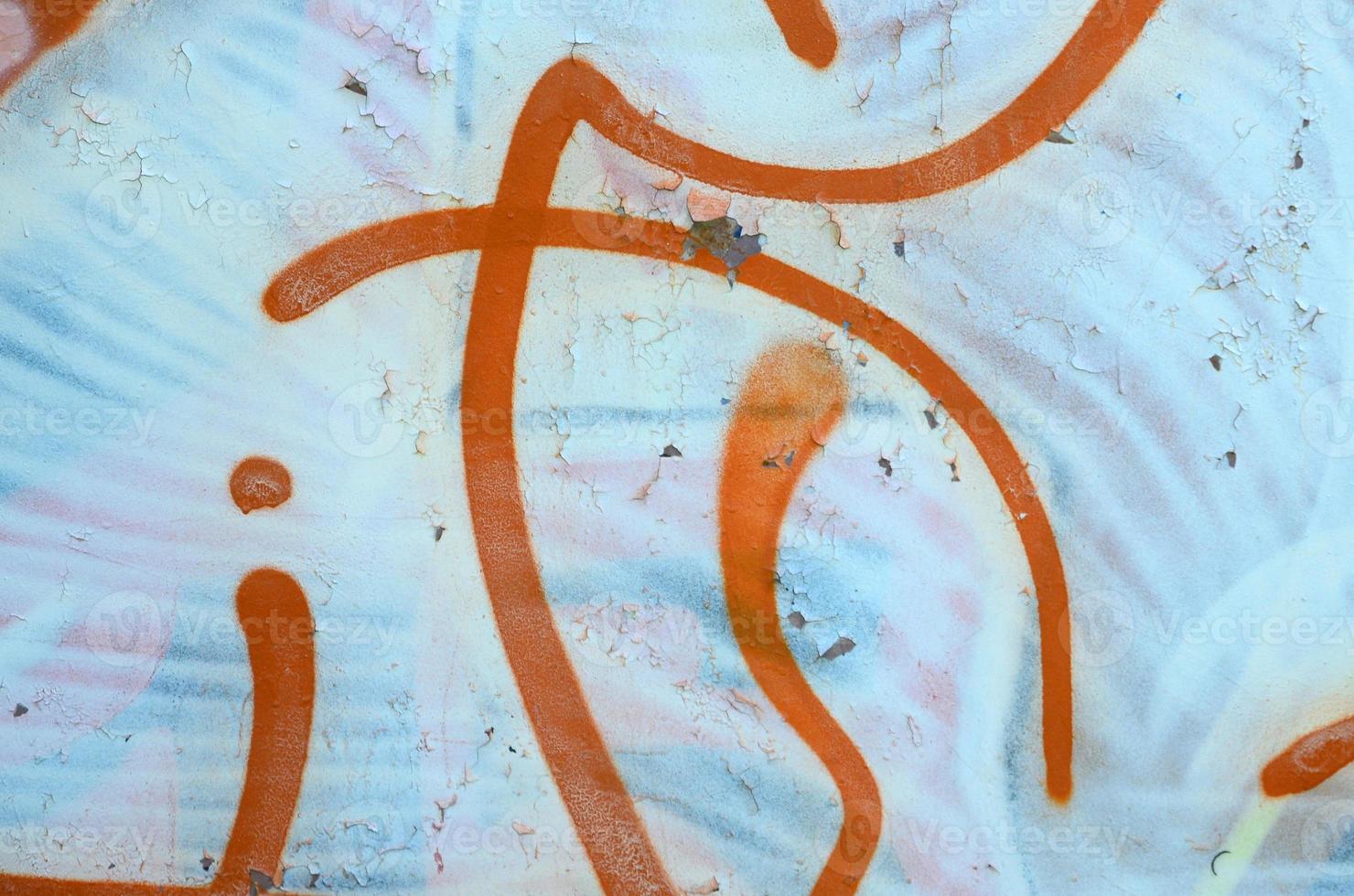 Street art. Abstract background image of a fragment of a colored graffiti painting in white and orange tones photo