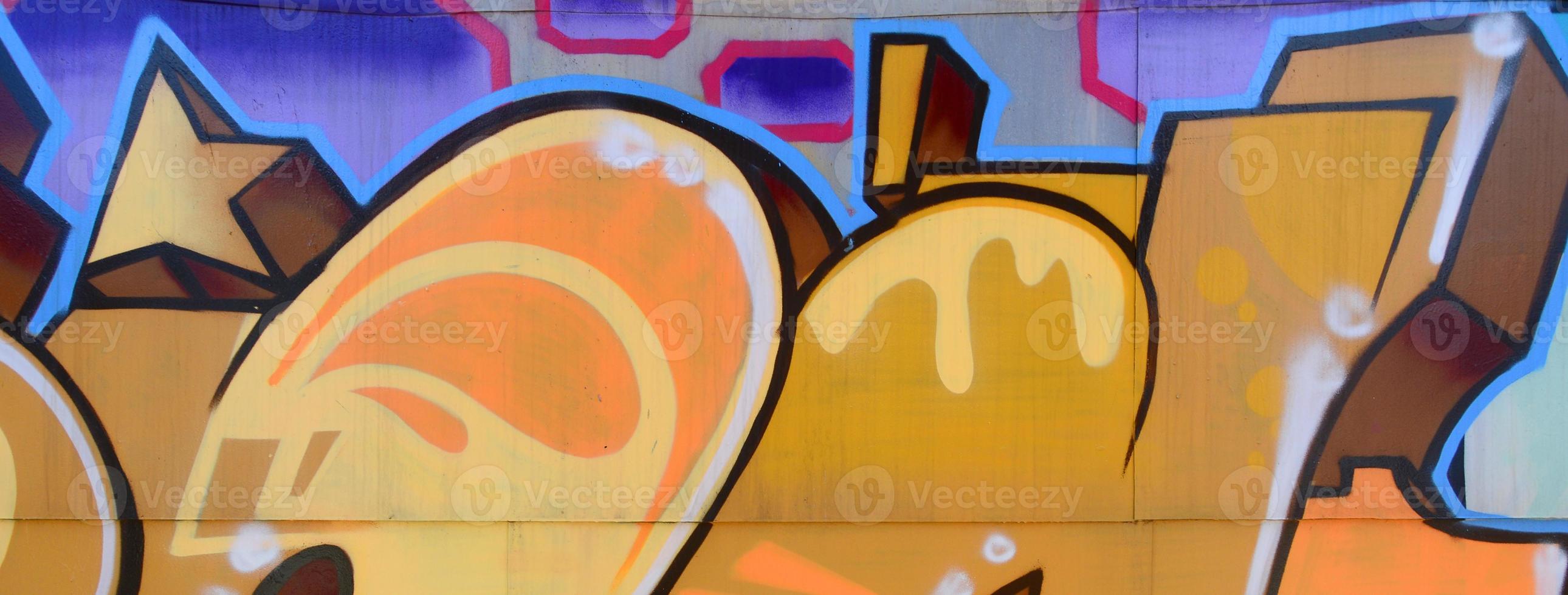 Street art. Abstract background image of a fragment of a colored graffiti painting in beige and orange tones photo