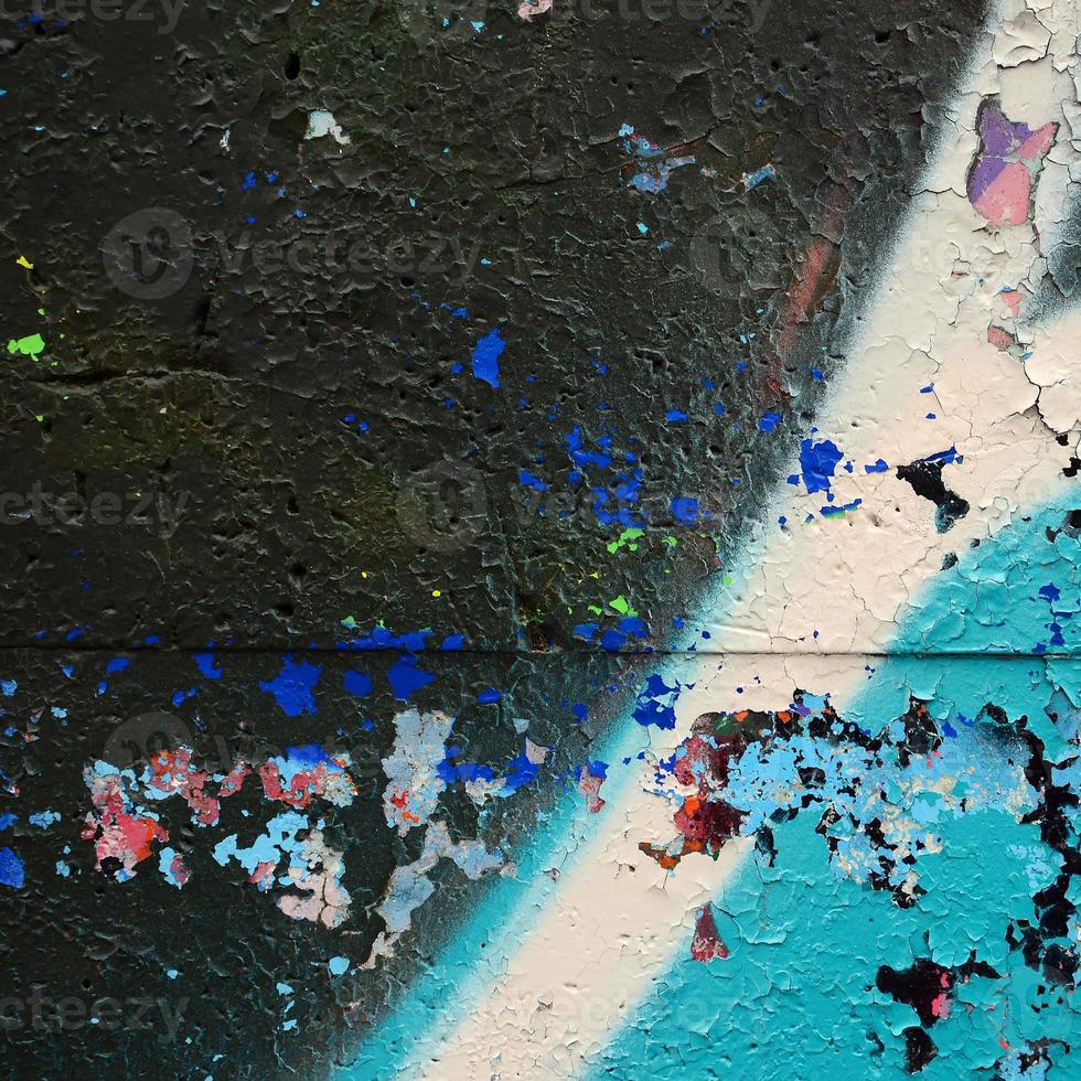 Street art. Abstract background image of a fragment of a colored graffiti painting in blue tones photo