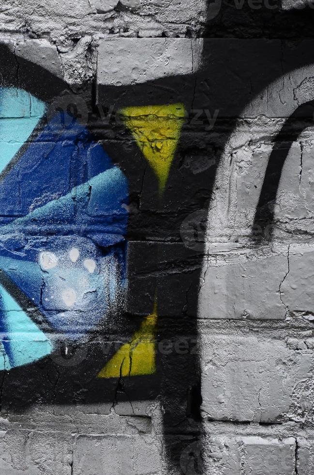 Street art. Abstract background image of a fragment of a colored graffiti painting in chrome and blue tones photo