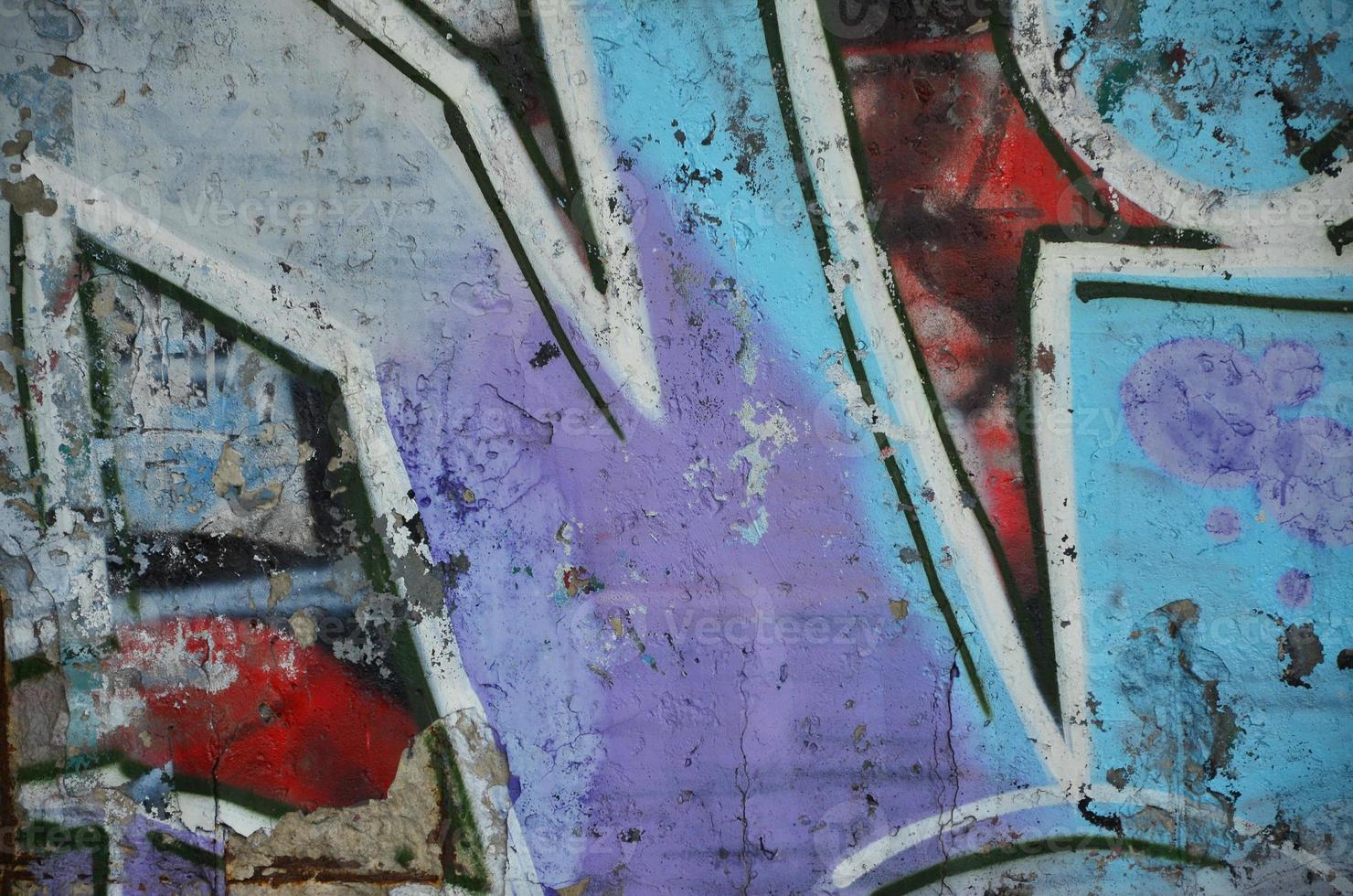 Texture of a fragment of the wall with graffiti painting, which is depicted on it. An image of a piece of graffiti drawing as a photo on street art and graffiti culture topics