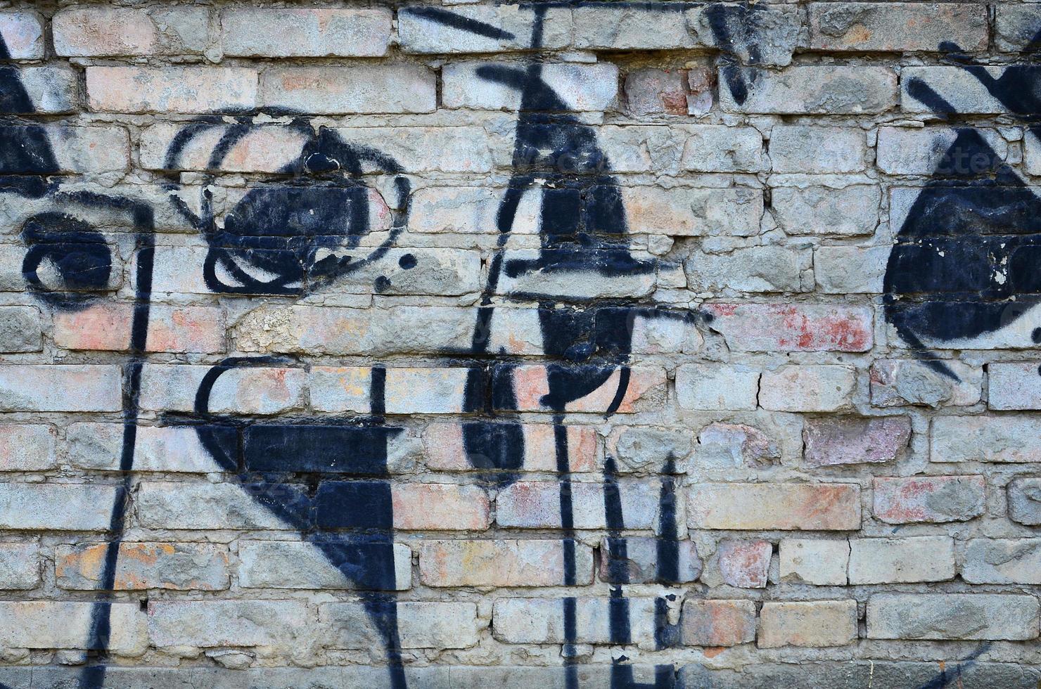 Texture of a fragment of the wall with graffiti painting, which is depicted on it. An image of a piece of graffiti drawing as a photo on street art and graffiti culture topics