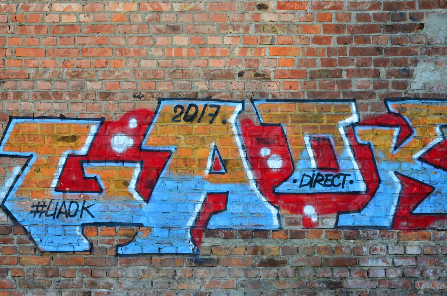 The texture of the wall with graffiti, which is depicted on it. The image of the whole and complete graffiti of the drawing as a resource for the design of 3D projects photo