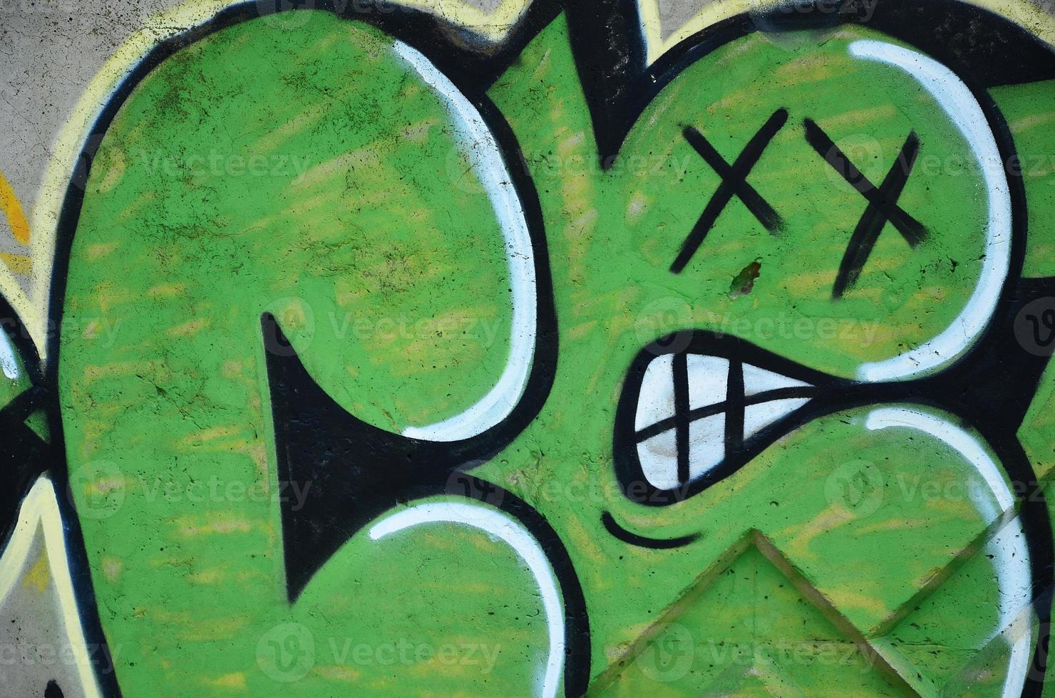 Texture of a fragment of the wall with graffiti painting, which is depicted on it. An image of a piece of graffiti drawing as a photo on street art and graffiti culture topics