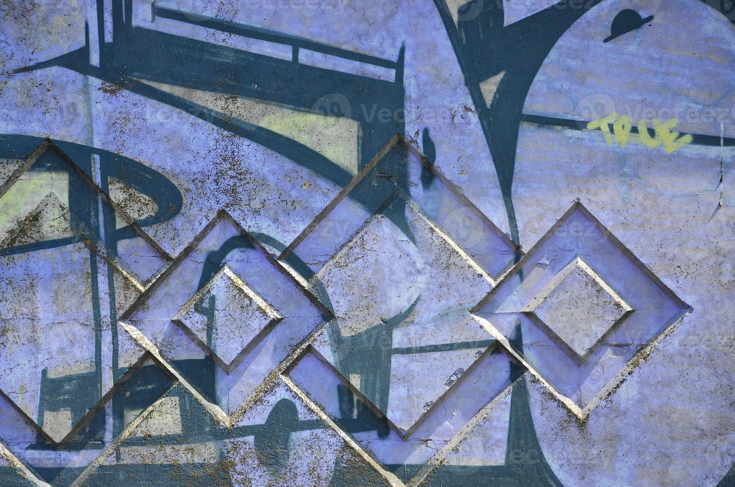 Texture of a fragment of the wall with graffiti painting, which is depicted on it. An image of a piece of graffiti drawing as a photo on street art and graffiti culture topics