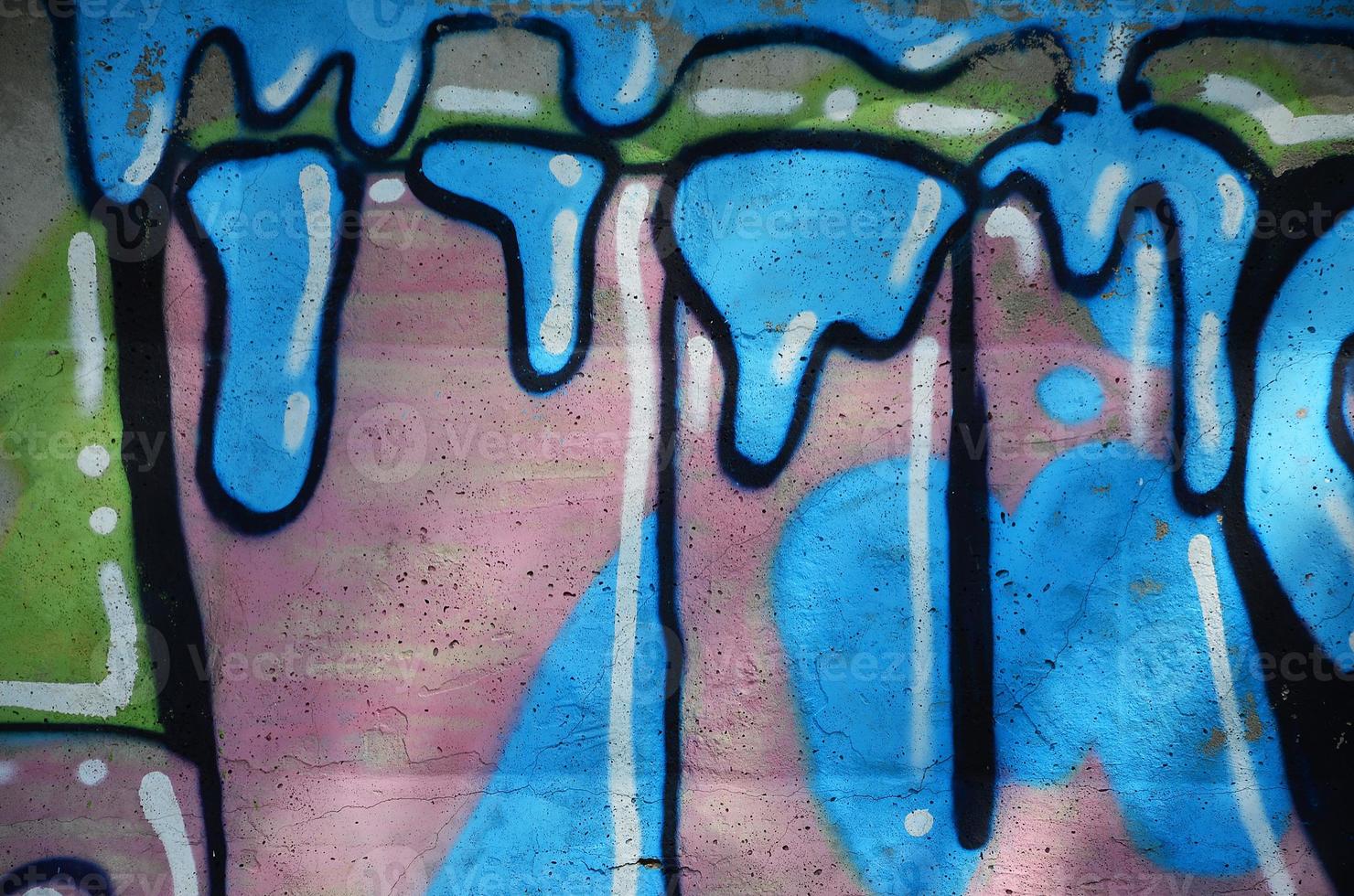 Texture of a fragment of the wall with graffiti painting, which is depicted on it. An image of a piece of graffiti drawing as a photo on street art and graffiti culture topics