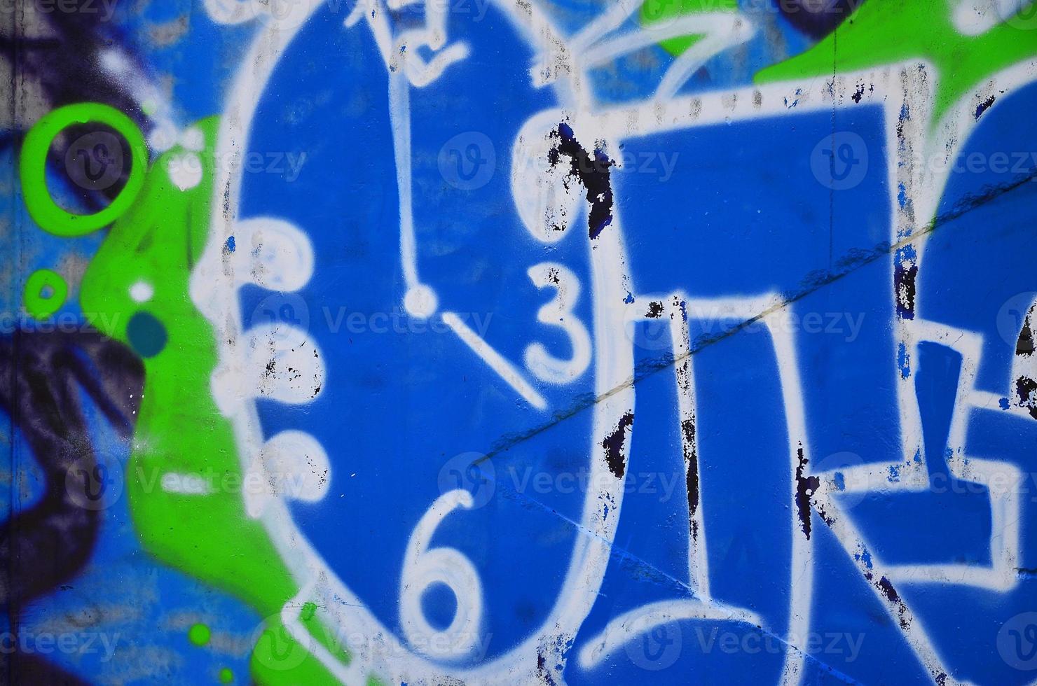 Texture of a fragment of the wall with graffiti painting, which is depicted on it. An image of a piece of graffiti drawing as a photo on street art and graffiti culture topics