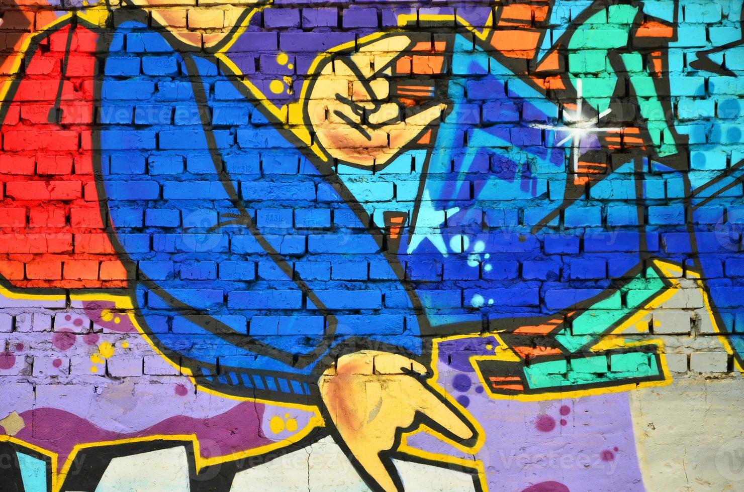 Detailed image of color graffiti drawing. Background Street art background with a painted character. Part of the colorful masterpiece by the professional graffiti artists photo
