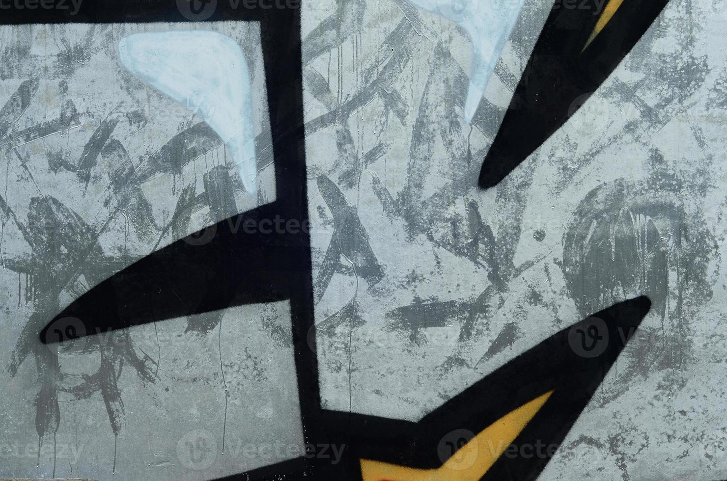 Background image with a graffiti pattern, which is applied to a concrete wall with aerosol paints photo