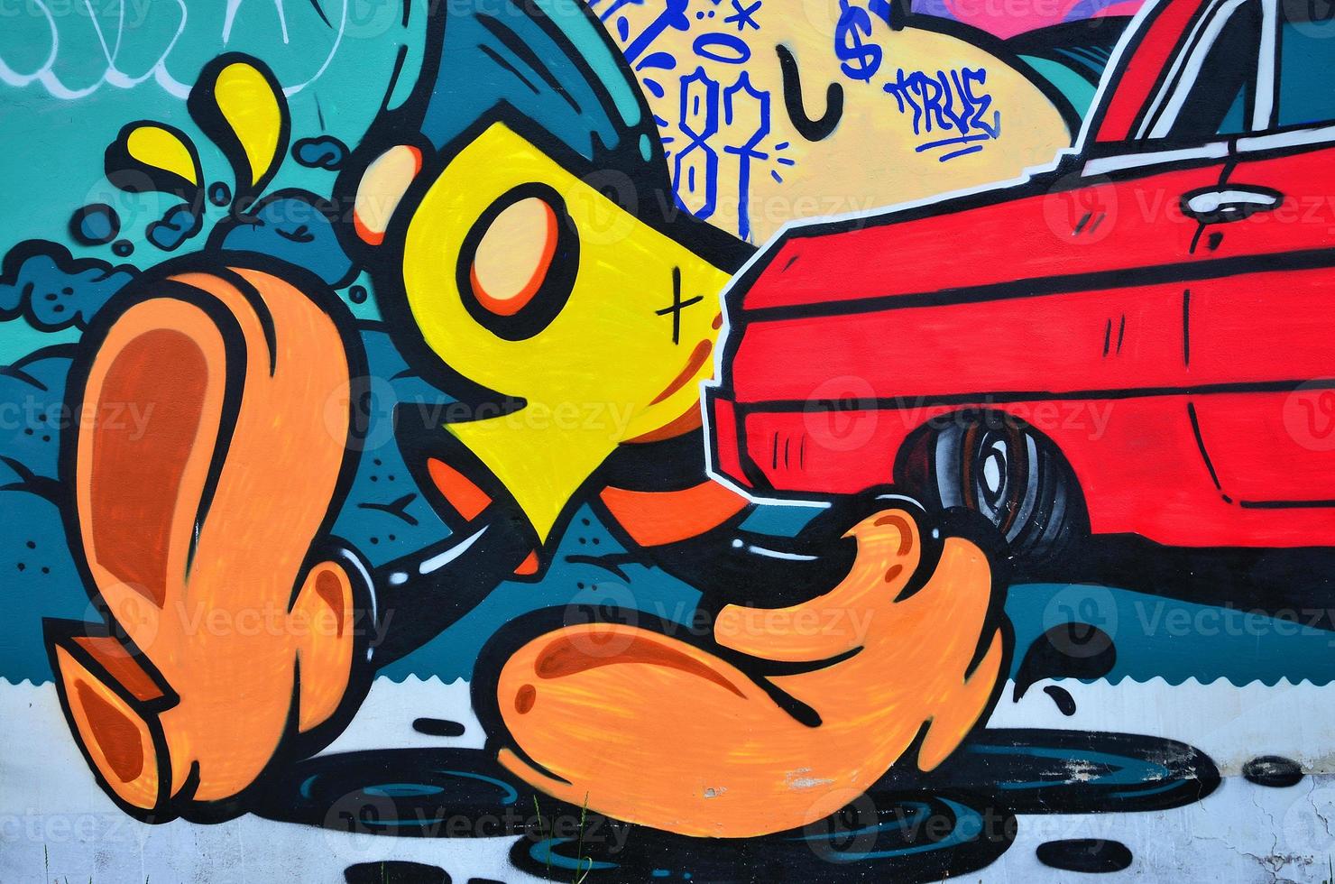 A detailed image of the graffiti drawing. A conceptual street art background with cartoon characters photo