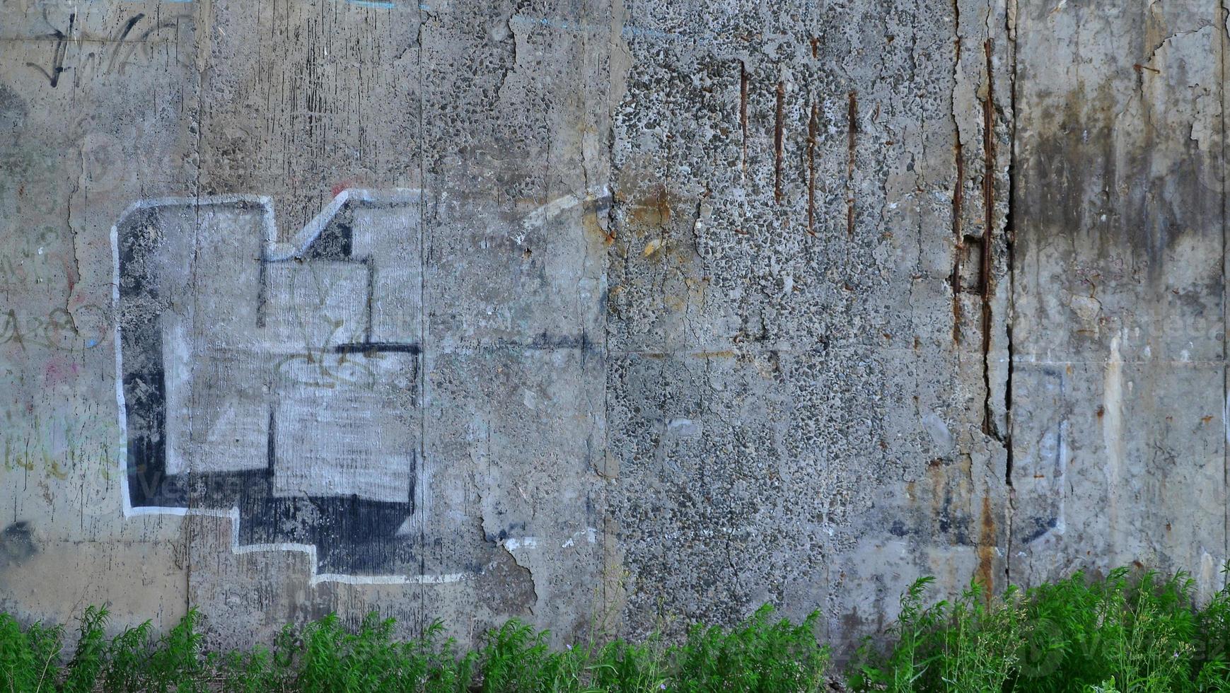 Detailed image of very old and aged color graffiti drawing on the wall. Background grunge street art picture photo