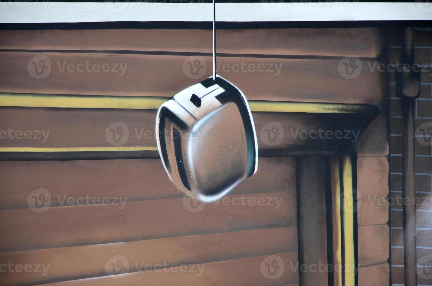 Detailed image of color graffiti drawing. Background Street art background depicting a hanging toaster photo
