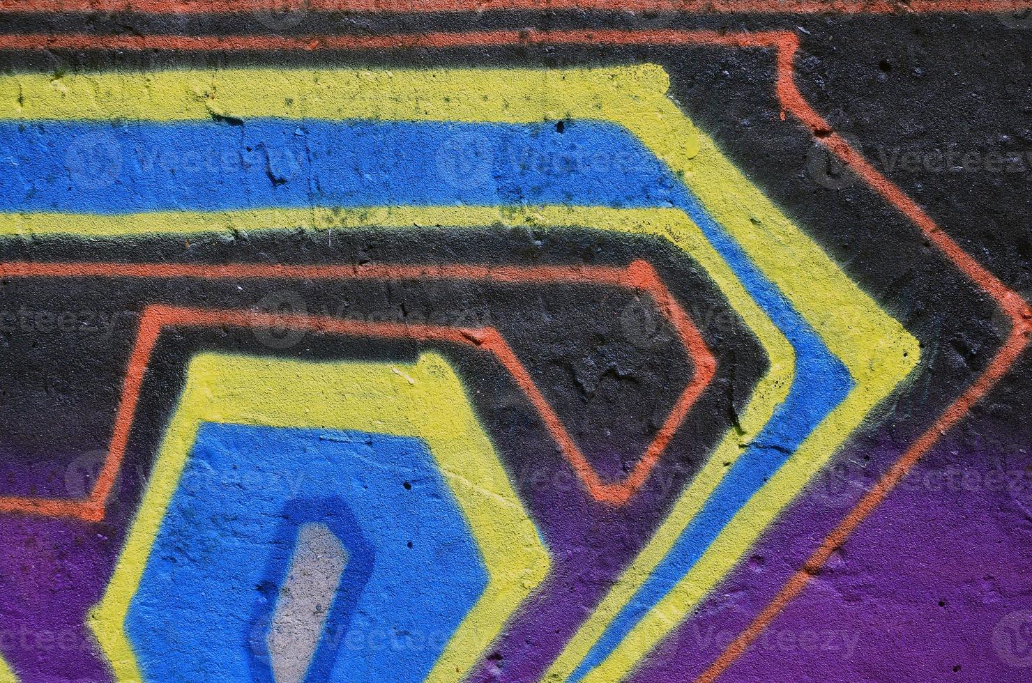 Street art. Colorful graffiti on the wall. Fragment for background. Abstract detail of a graffiti photo