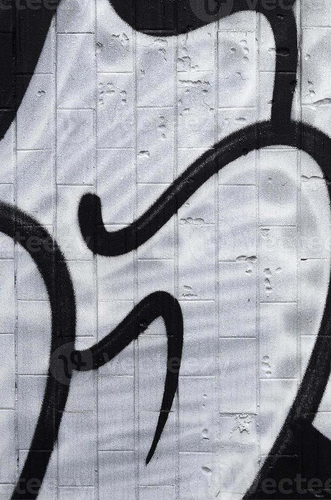 A fragment of a graffiti pattern, applied to a wall of cold tiles, which is covered with a fine condensate. The concept of street art in inappropriate weather photo