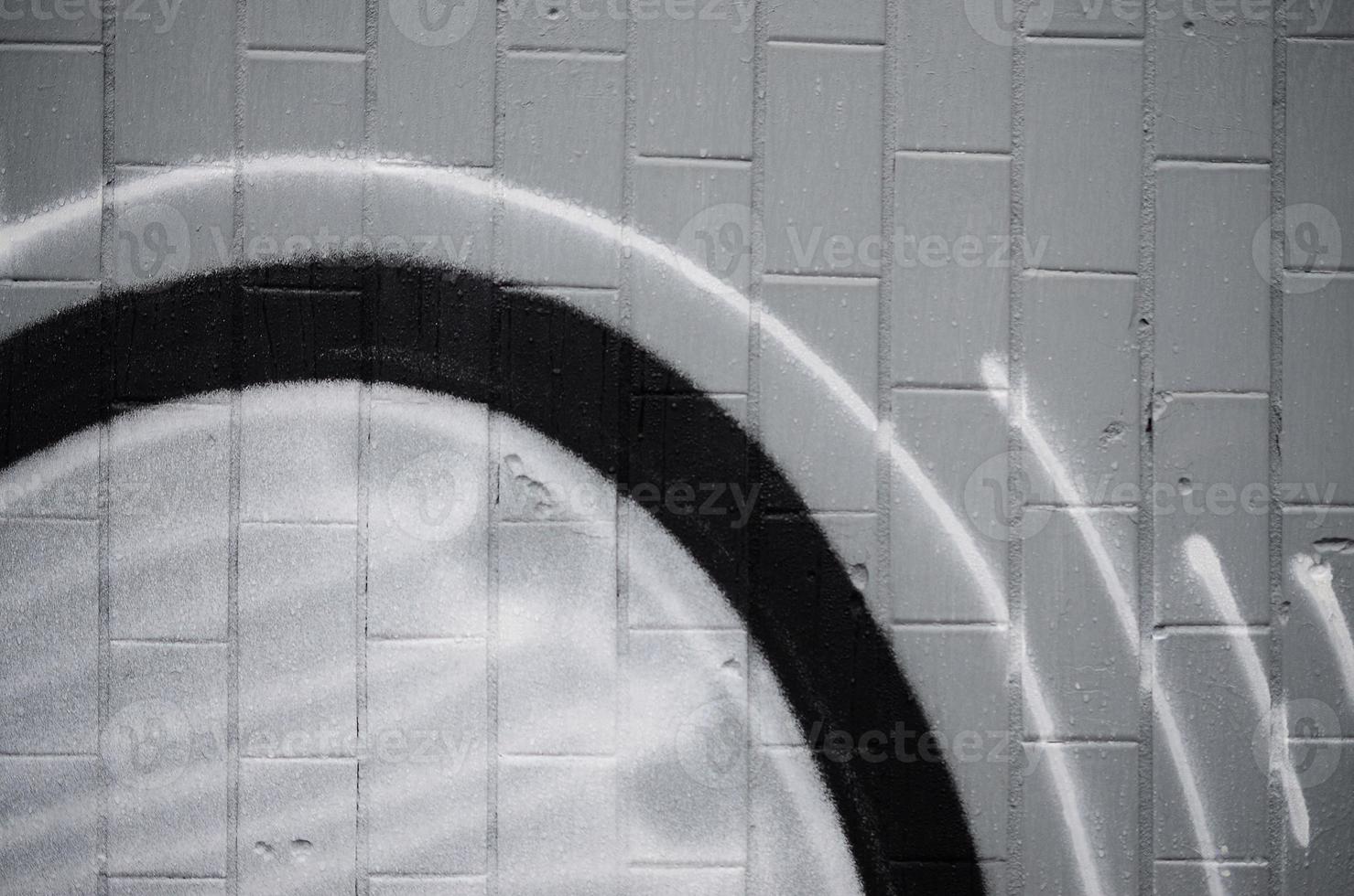 A fragment of a graffiti pattern, applied to a wall of cold tiles, which is covered with a fine condensate. The concept of street art in inappropriate weather photo