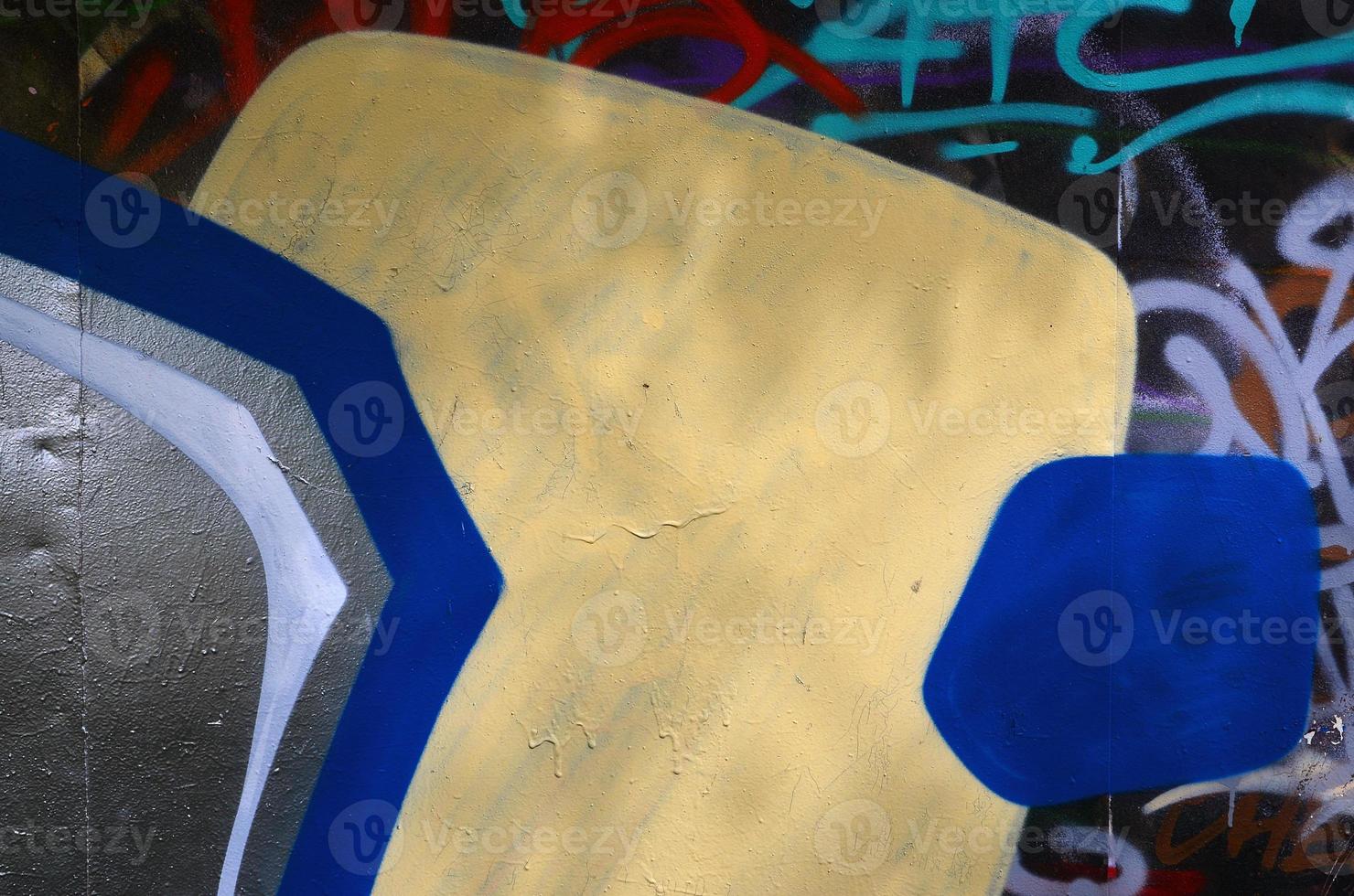 Background image of the wall decorated with colorful abstract graffiti. Street art concept photo