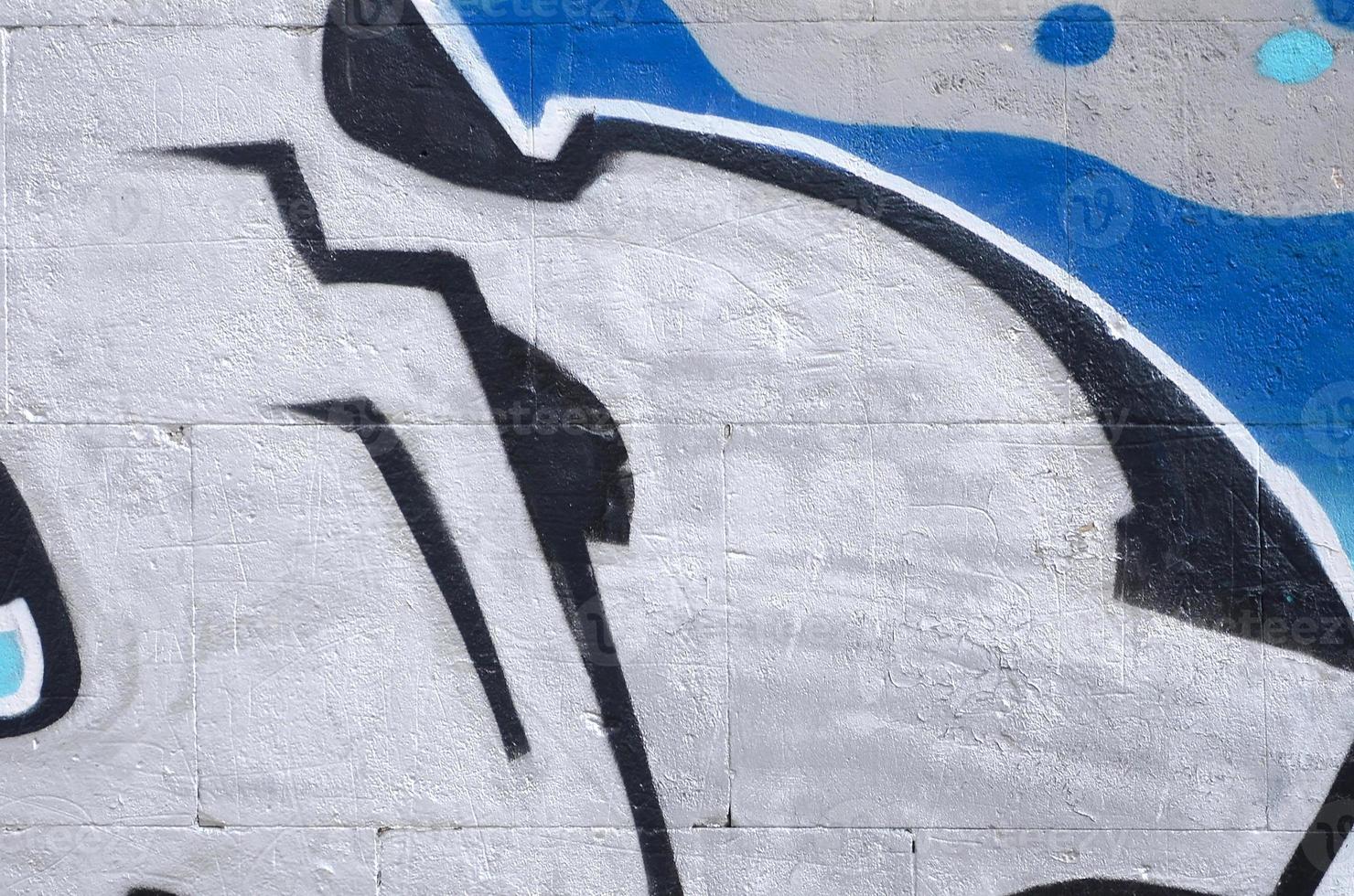 Fragment of colored street art graffiti paintings with contours and shading close up photo