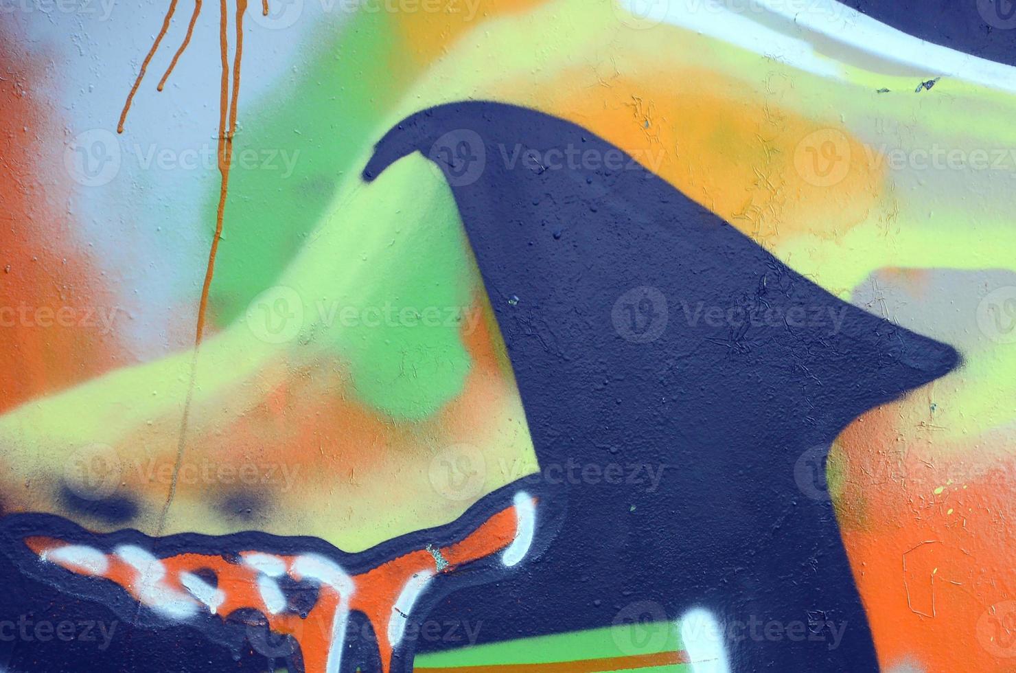 Street art. Abstract background image of a fragment of a colored graffiti painting in khaki green and orange tones photo