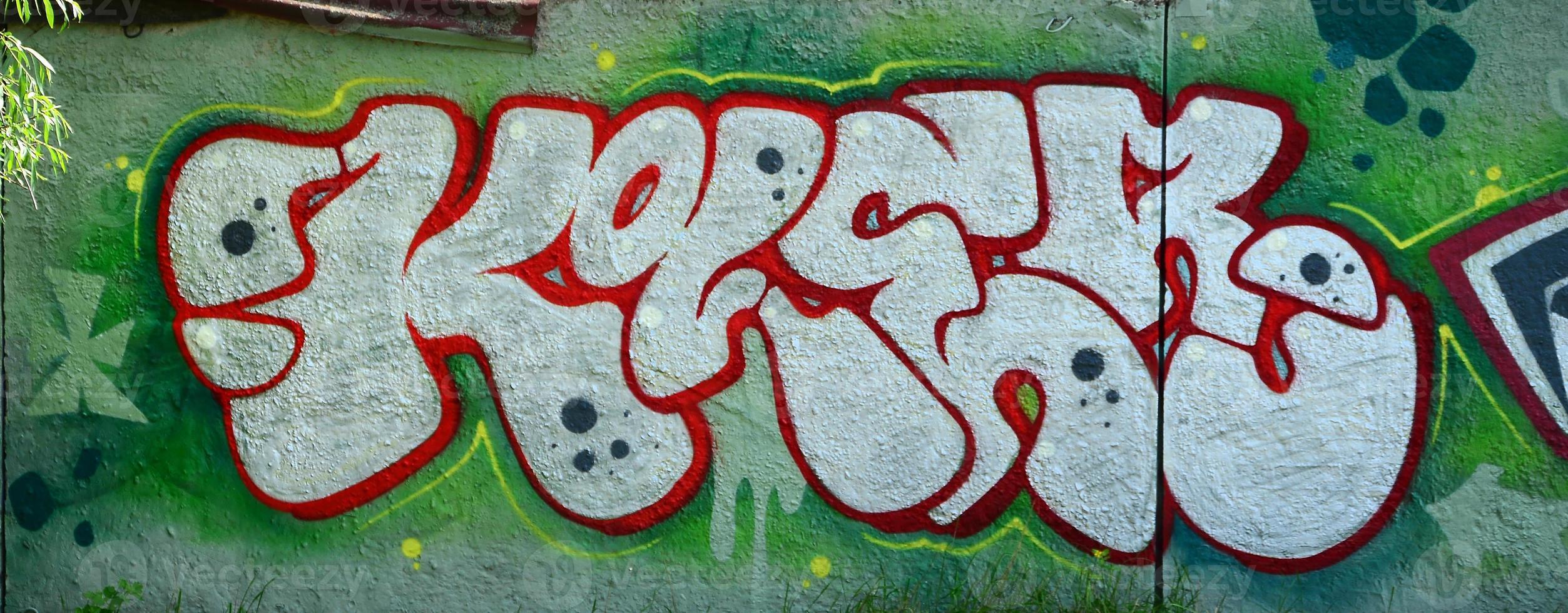 Street art. Abstract background image of a full completed graffiti painting in chrome fill, green background and red outlines photo