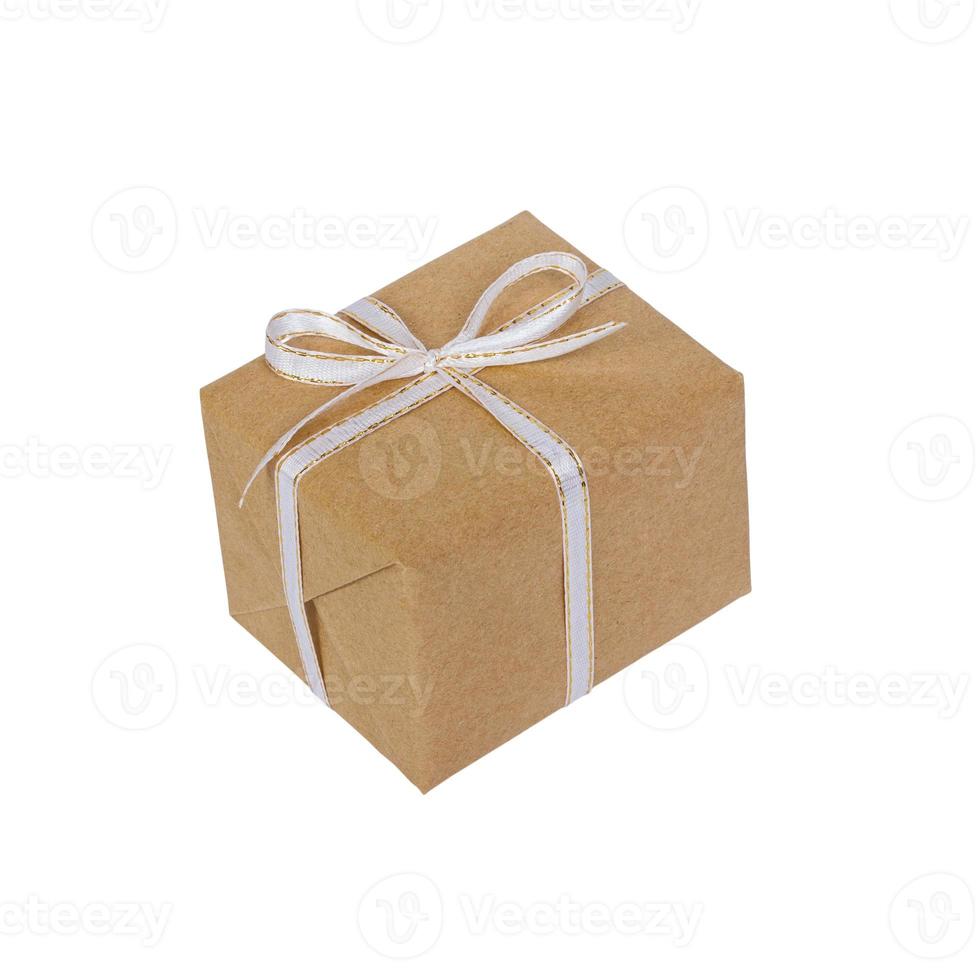 wrapped brown present box with white ribbon bow, isolated on white photo