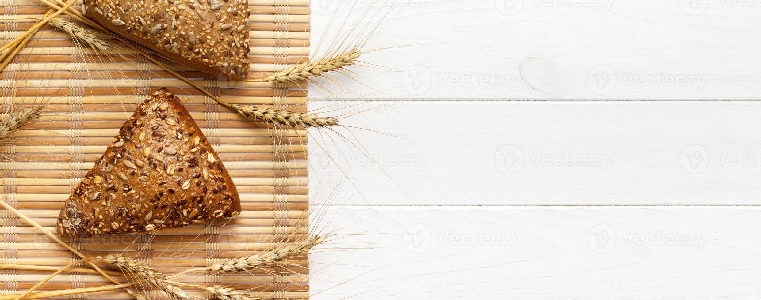 Several small multi grain triangular shaped bread sprinkled with whole sunflower seeds. banner for advertising and design, promo top view with copy space photo