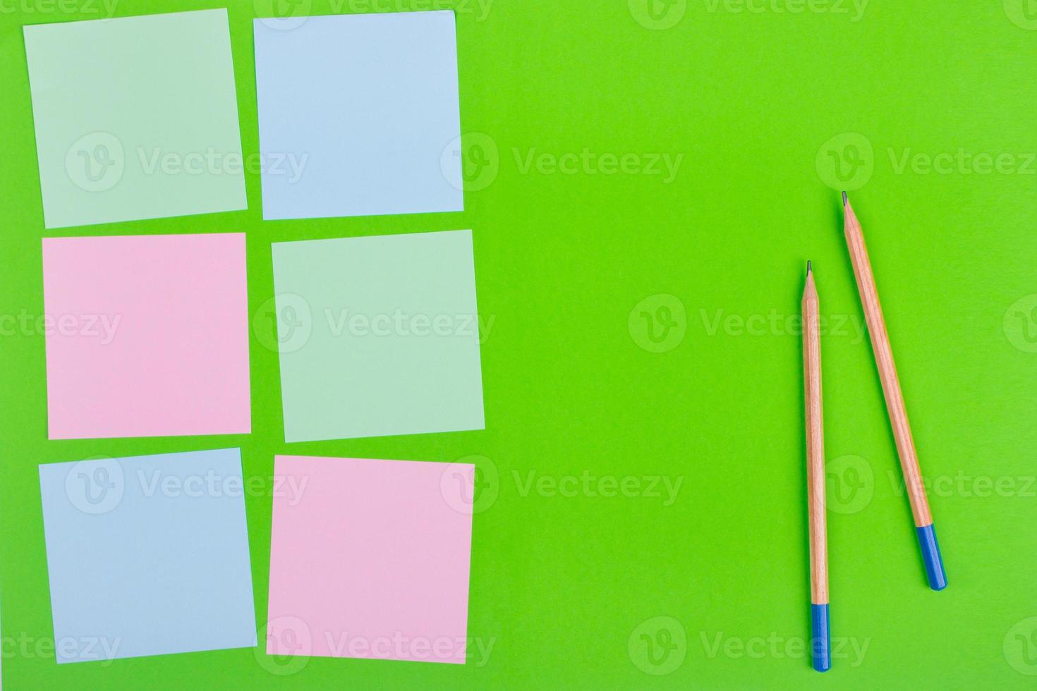 Colorful documents with copy space on a colored background. View from above. For notes and ideas. photo