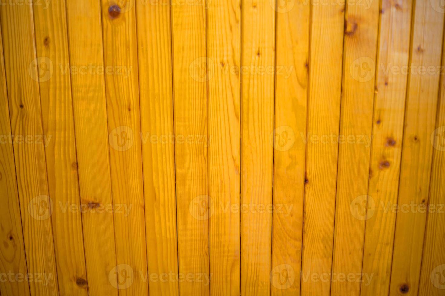 orange wood varnished fence plank texture background photo