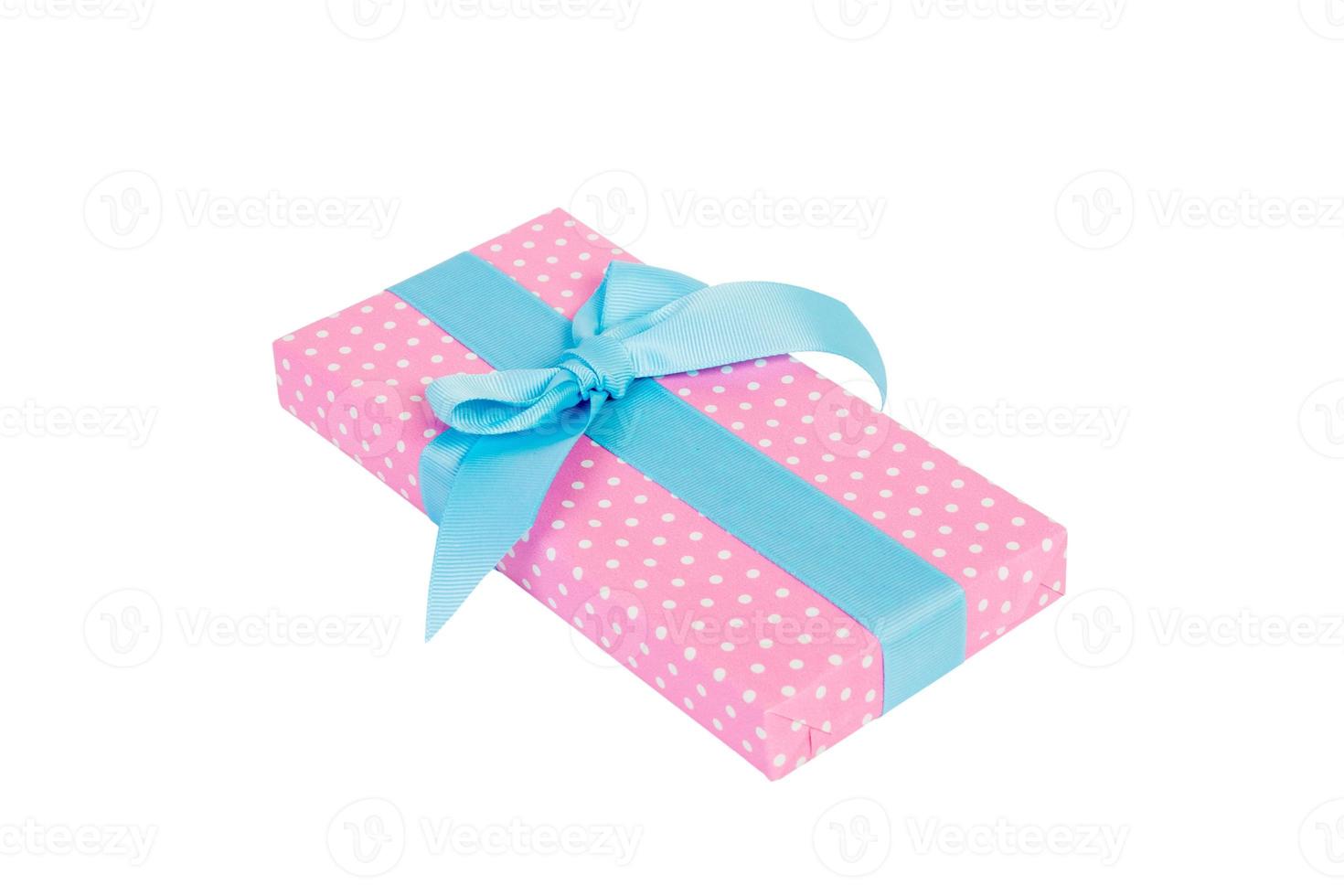 Christmas or other holiday handmade present in pink paper with blue ribbon. Isolated on white background, top view. thanksgiving Gift box concept photo