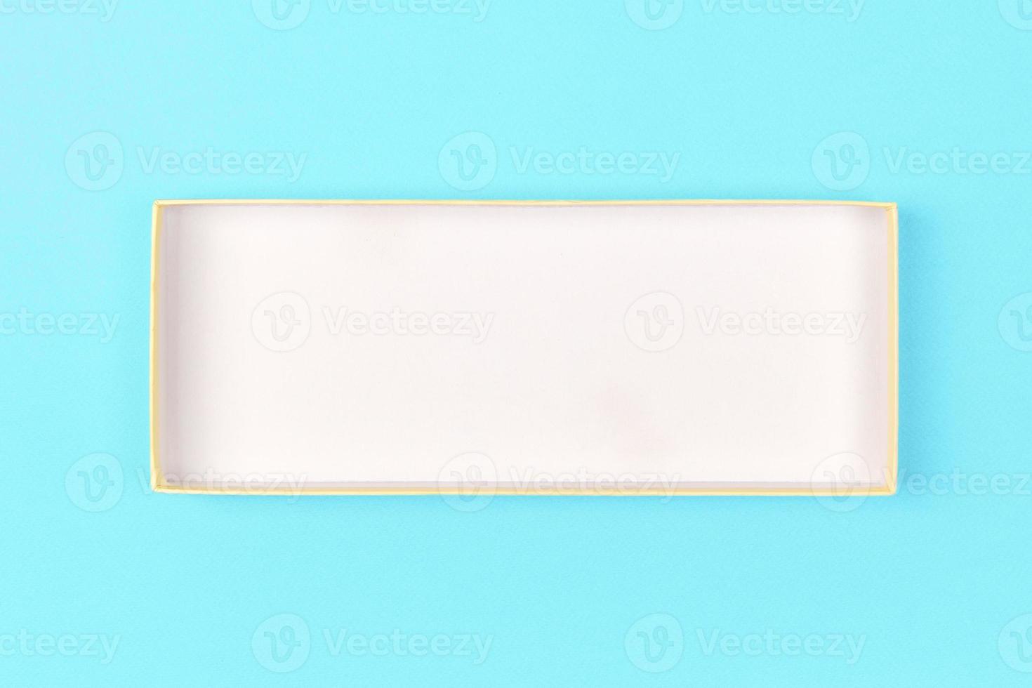 Empty box for product on blue background. top view photo