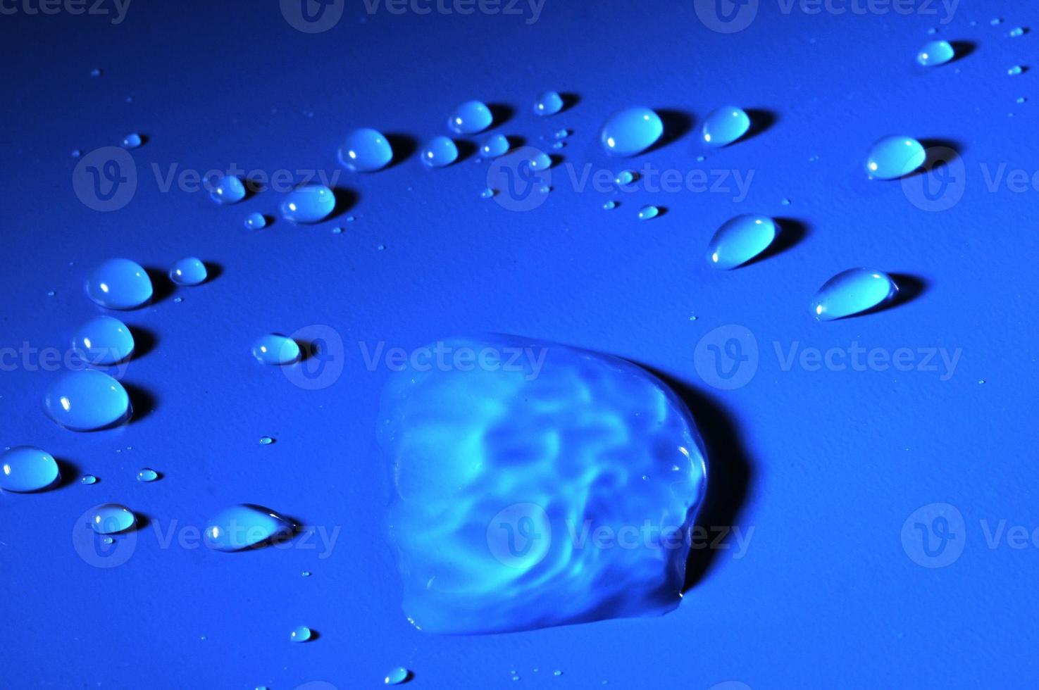 Water droplets on blue background photo