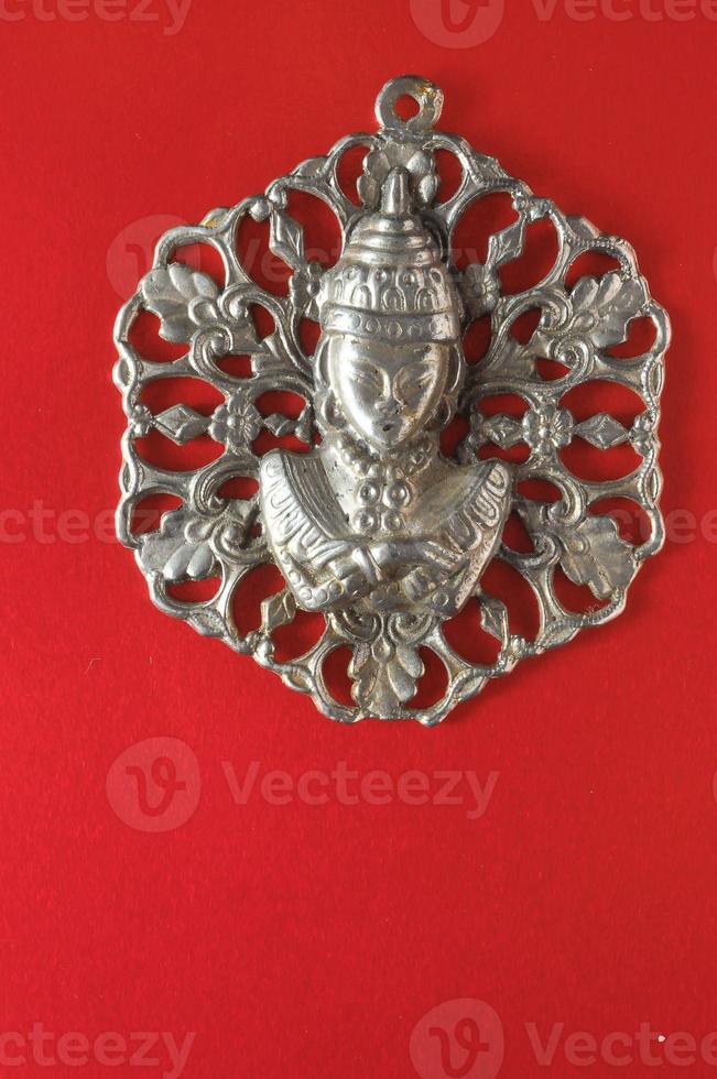 Isolated buddha pendant photo