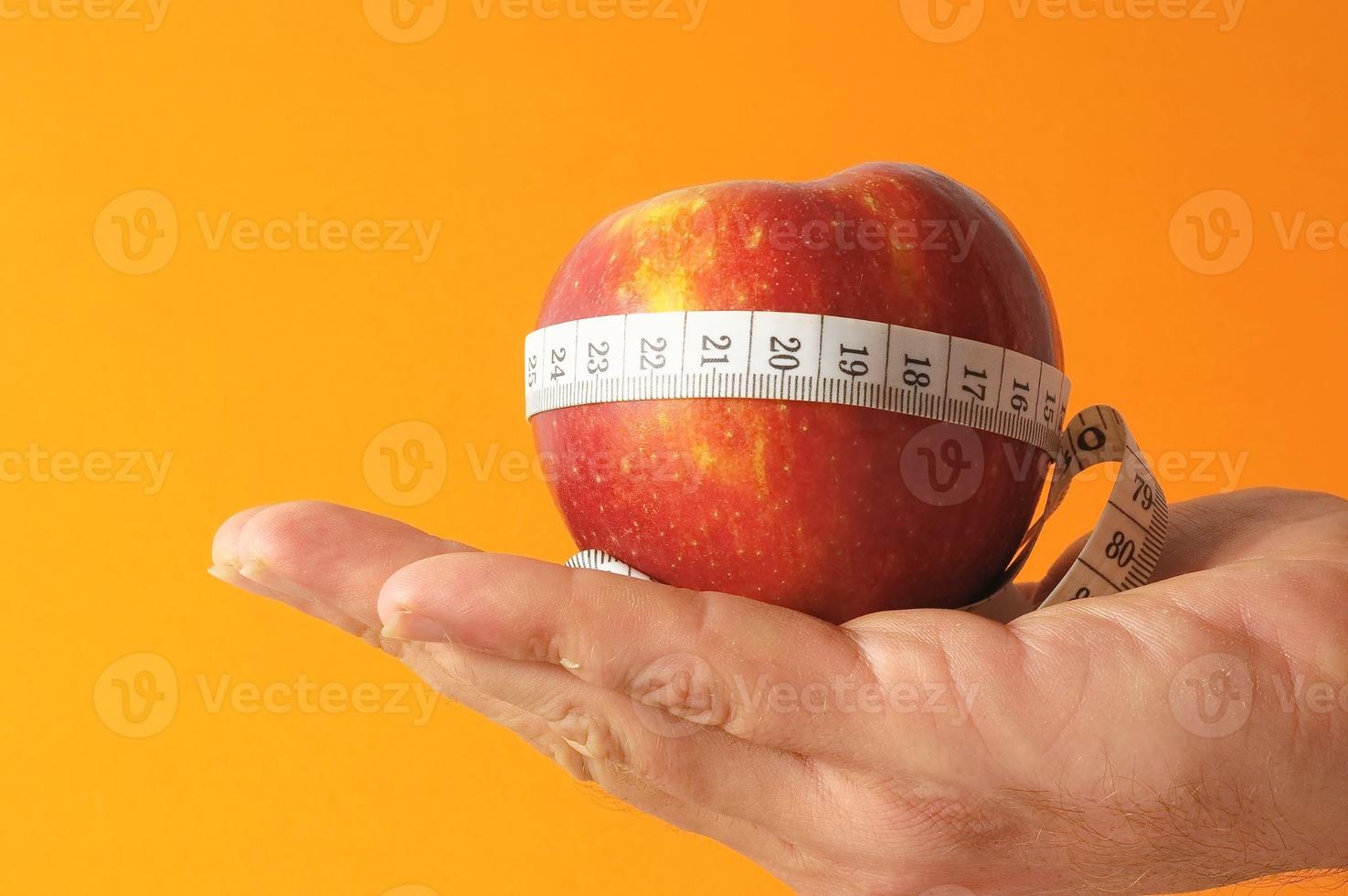 Hand with red apple photo