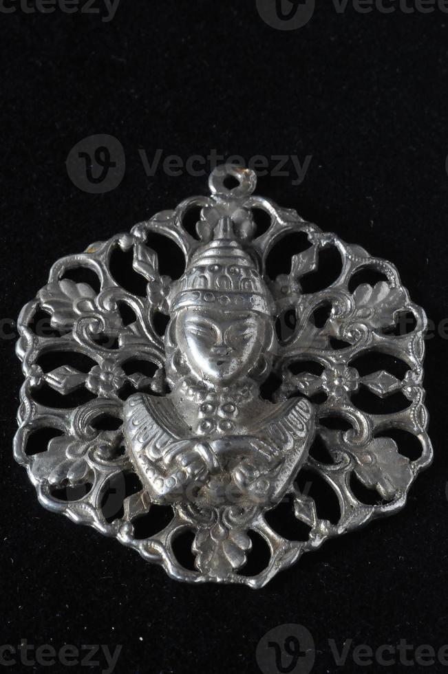 Isolated buddha pendant photo