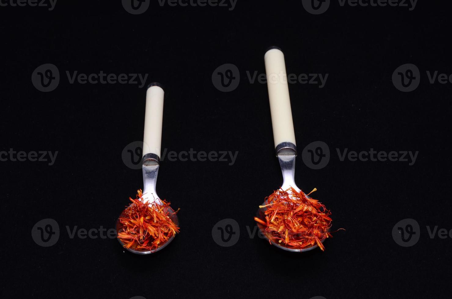 Spoons with red spices photo