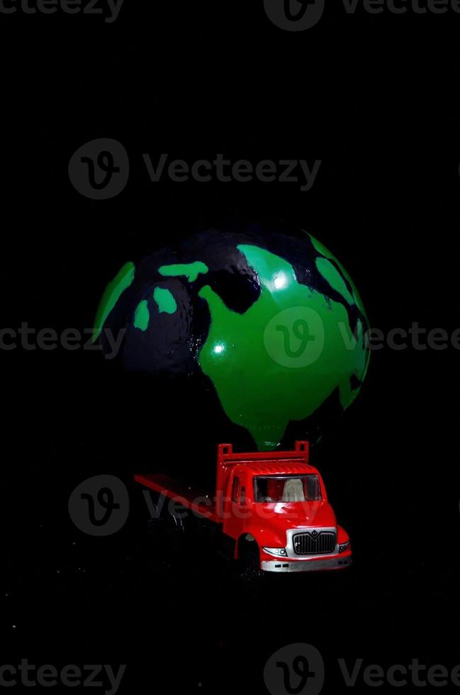 Toy truck on dark background photo