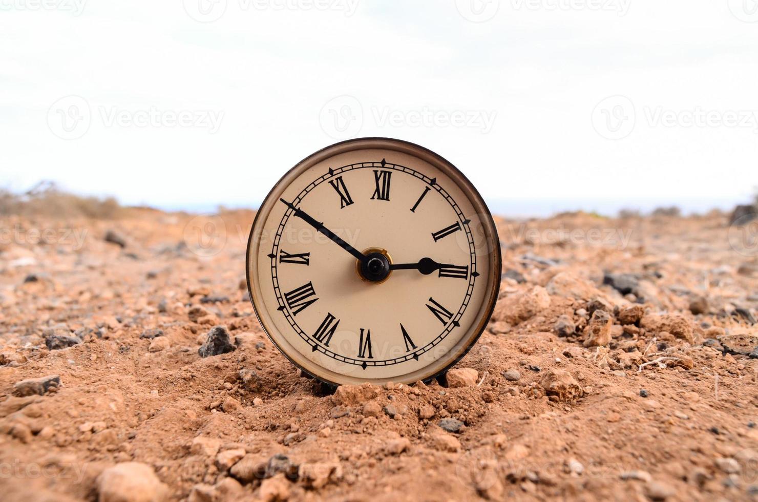 Clock on the ground photo