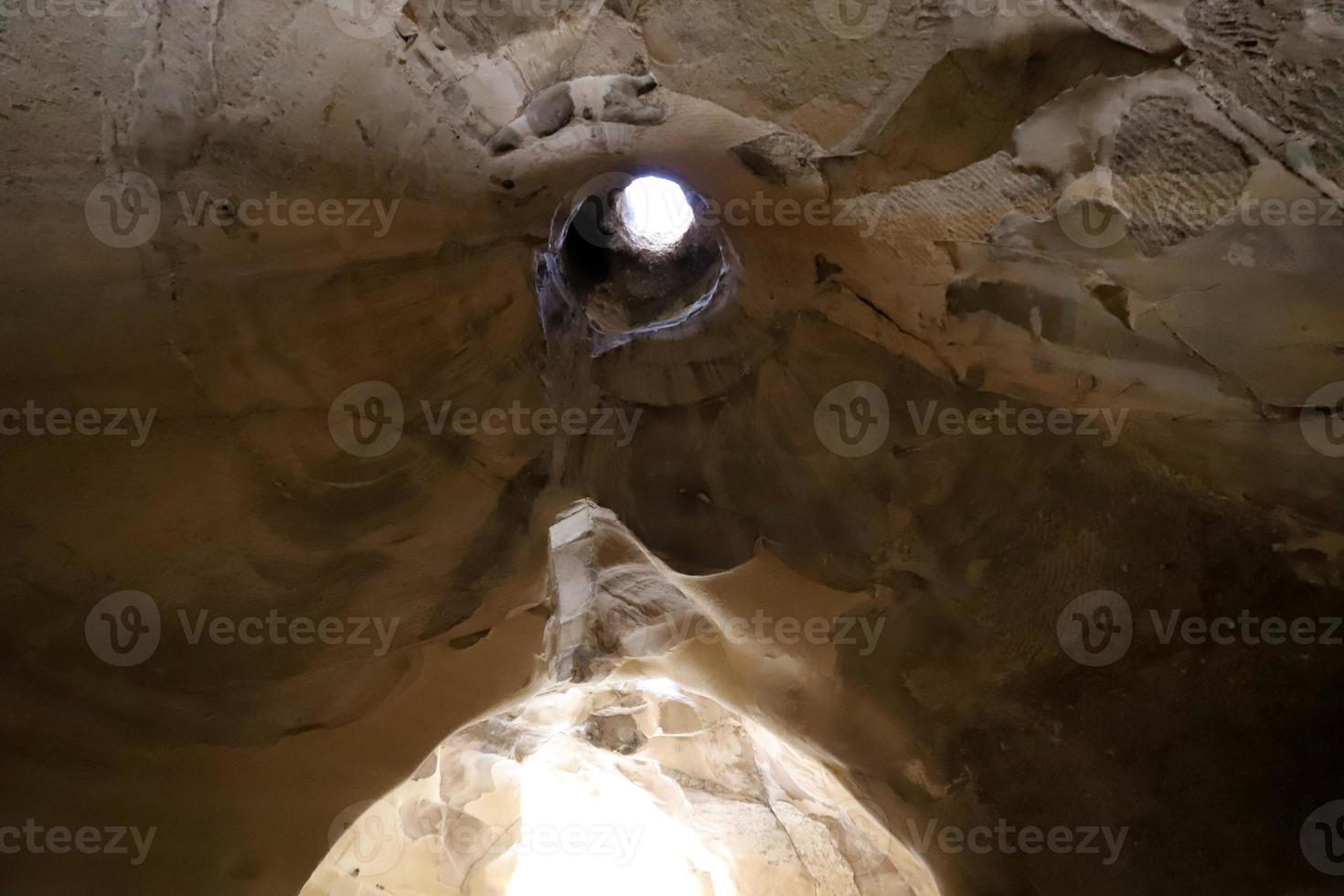 Cave in the chalk cliffs in southern Israel. photo