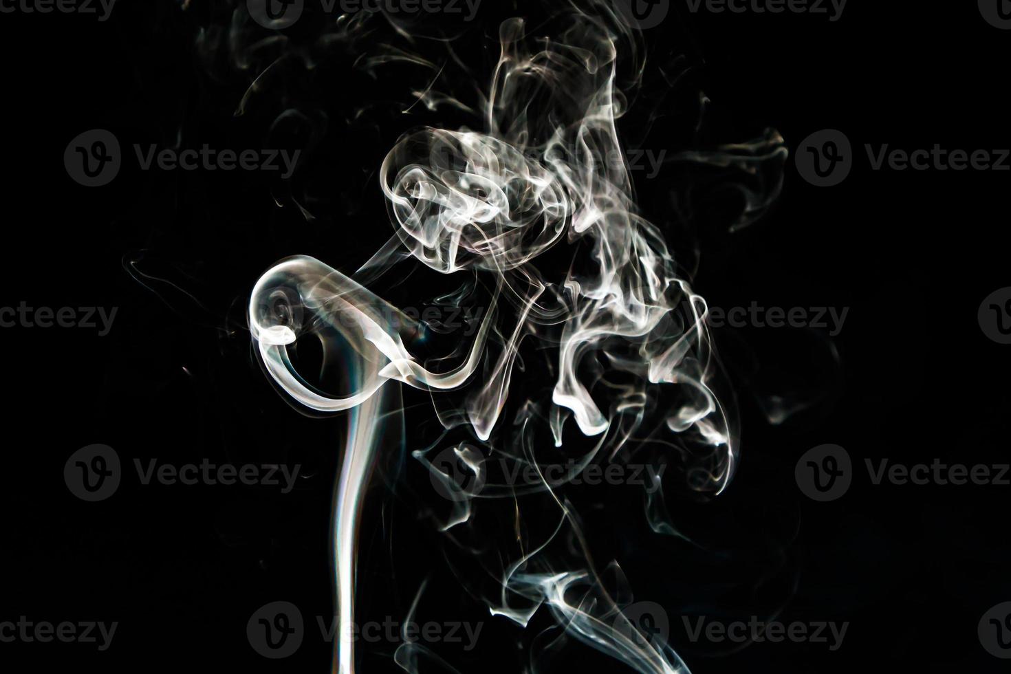 Smoke effect texture. Isolated background. Black and dark backdrop. Smokey fire and mistic effect. photo