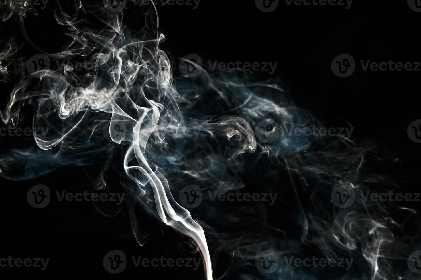 Smoke effect texture. Isolated background. Black and dark backdrop. Smokey fire and mistic effect. photo