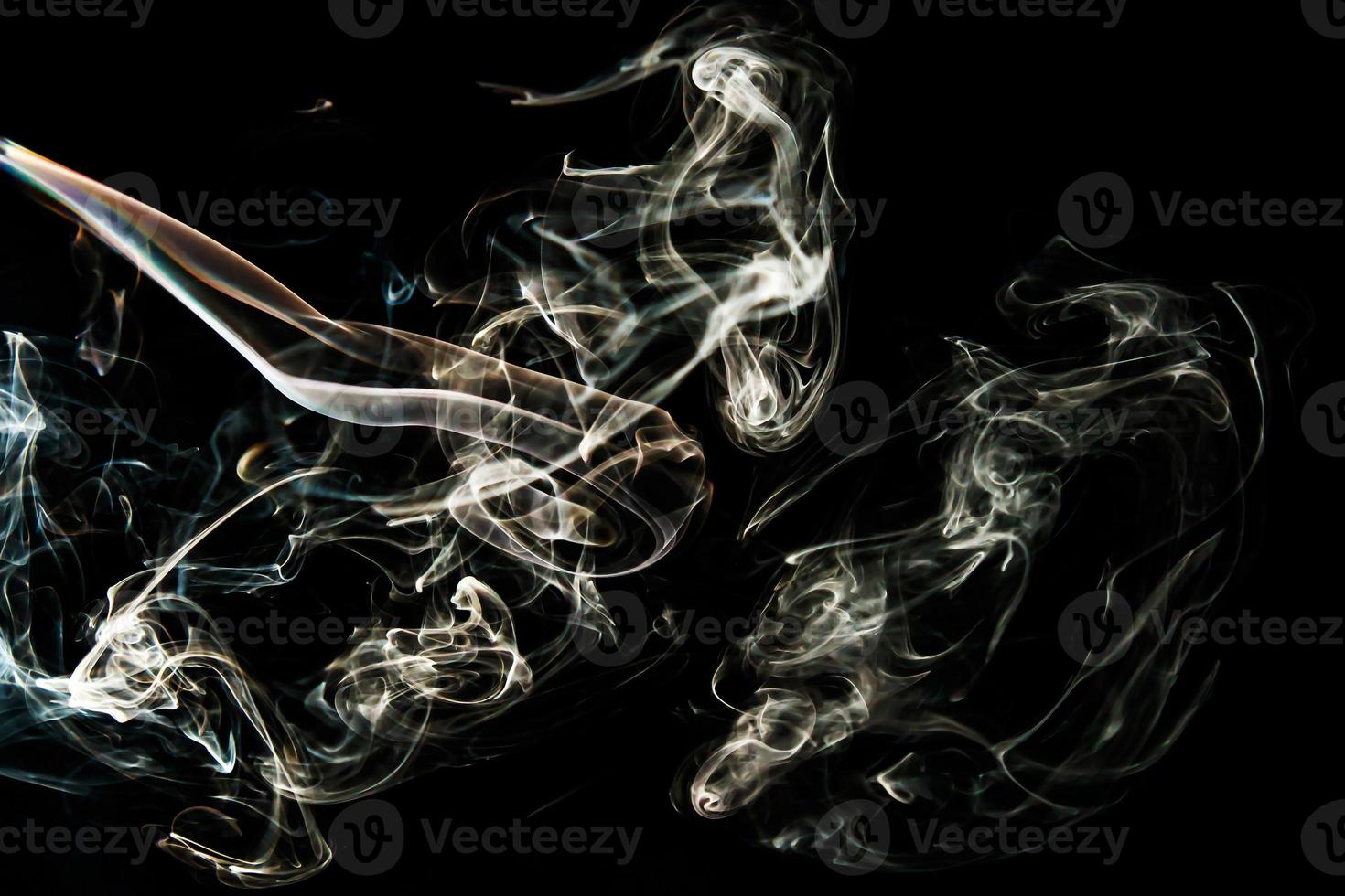 Smoke effect texture. Isolated background. Black and dark backdrop. Smokey fire and mistic effect. photo