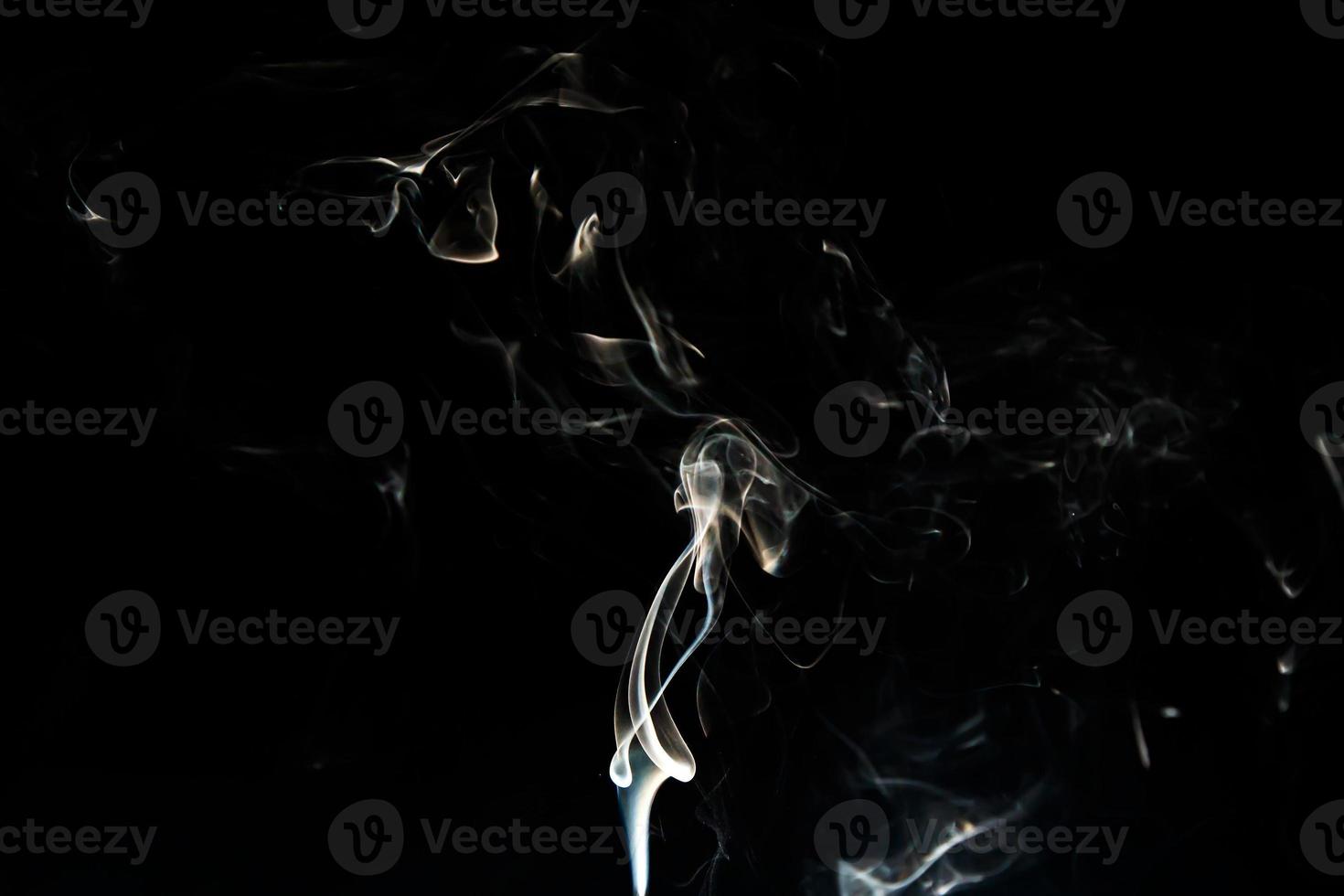 Smoke effect texture. Isolated background. Black and dark backdrop. Smokey fire and mistic effect. photo