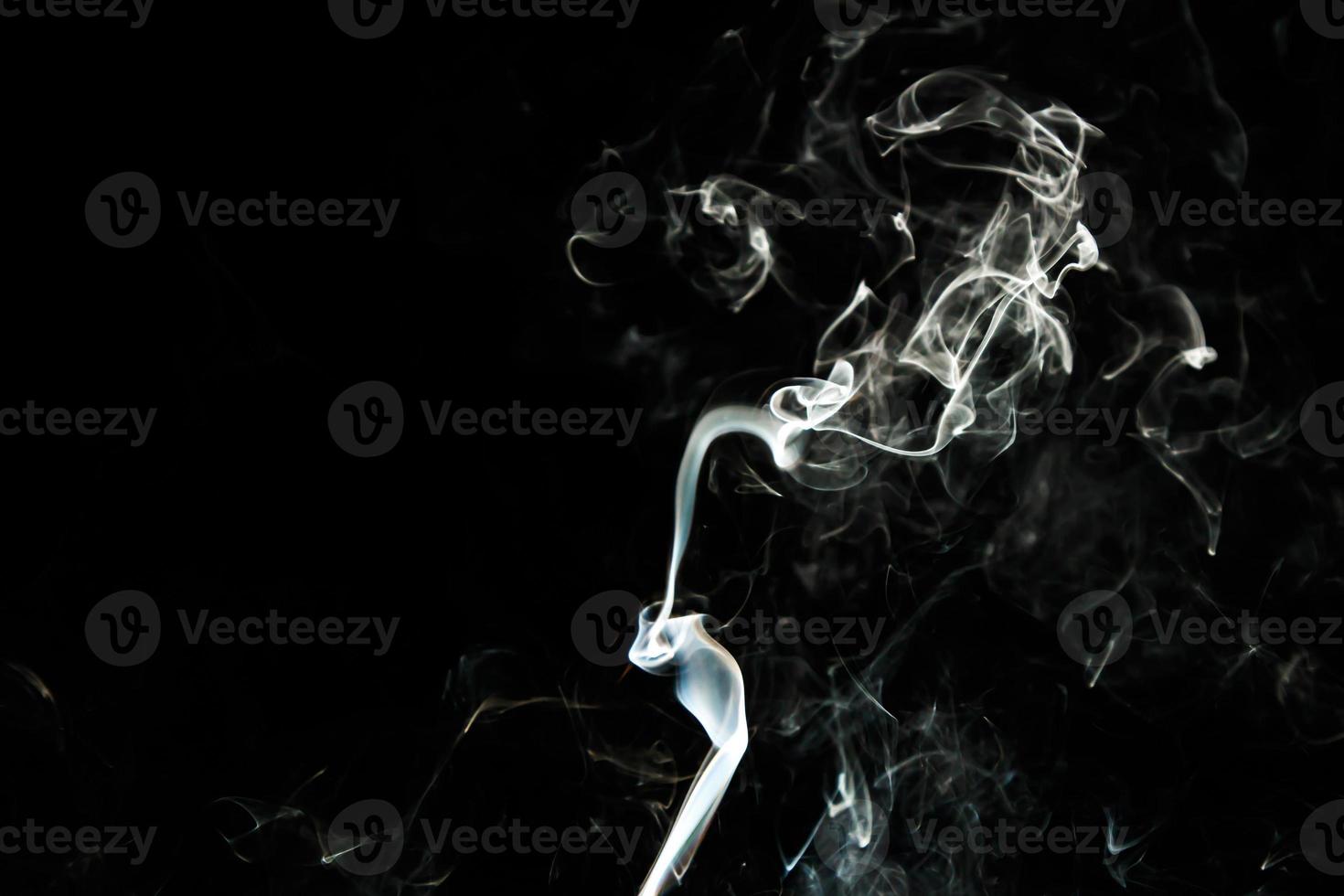 Smoke effect texture. Isolated background. Black and dark backdrop. Smokey fire and mistic effect. photo