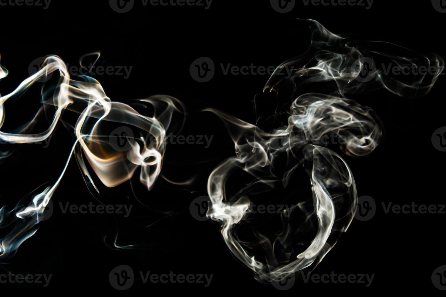 Smoke effect texture. Isolated background. Black and dark backdrop. Smokey fire and mistic effect. photo