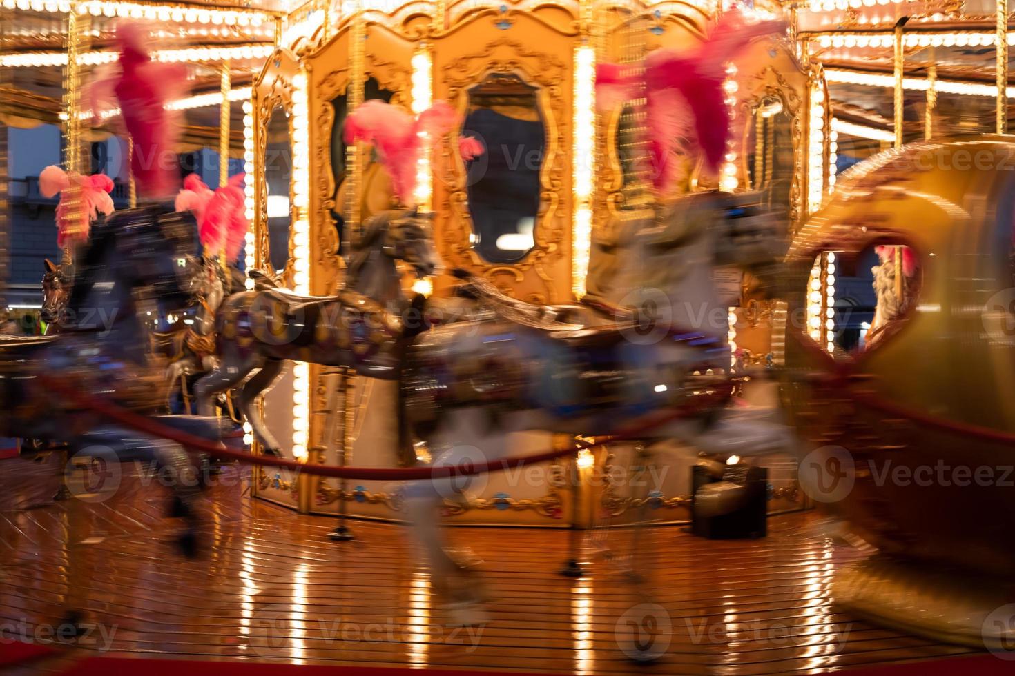 Blurry vintage merry-go-round carousel. Retro design, nostalgia concept. photo