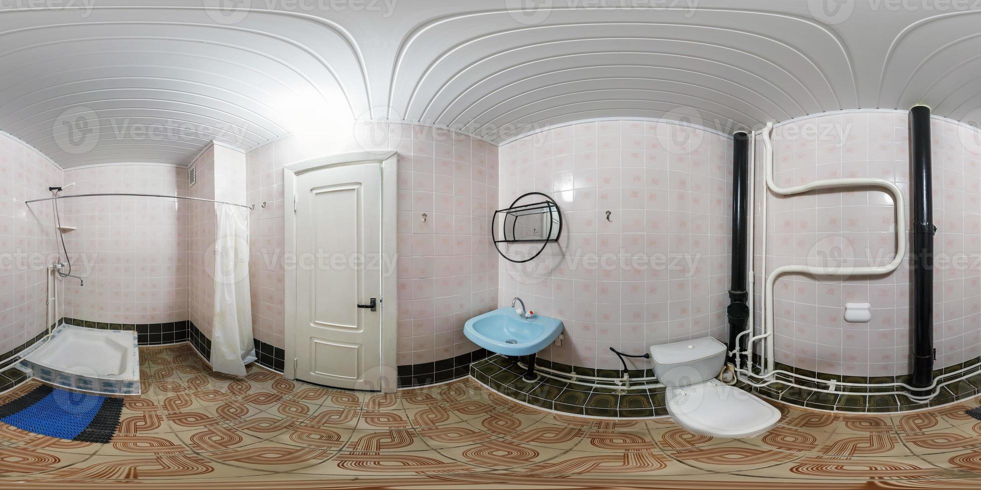 seamless 360 panorama in interior of bathroom of cheap hotel,  flat or apartments with toilet, washbasin and shower in equirectangular projection with zenith and nadir. VR AR content photo