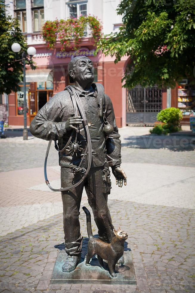 Monument of Happy Chimney Sweeper with cat photo