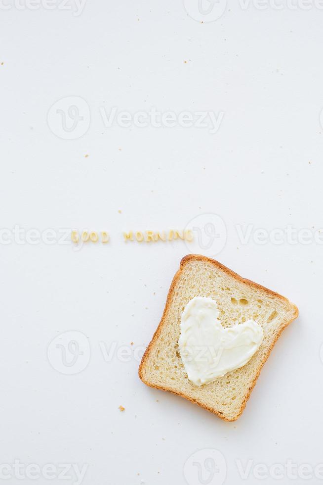 sandwich for breakfast in form of heart with cheese - good morning inscription photo